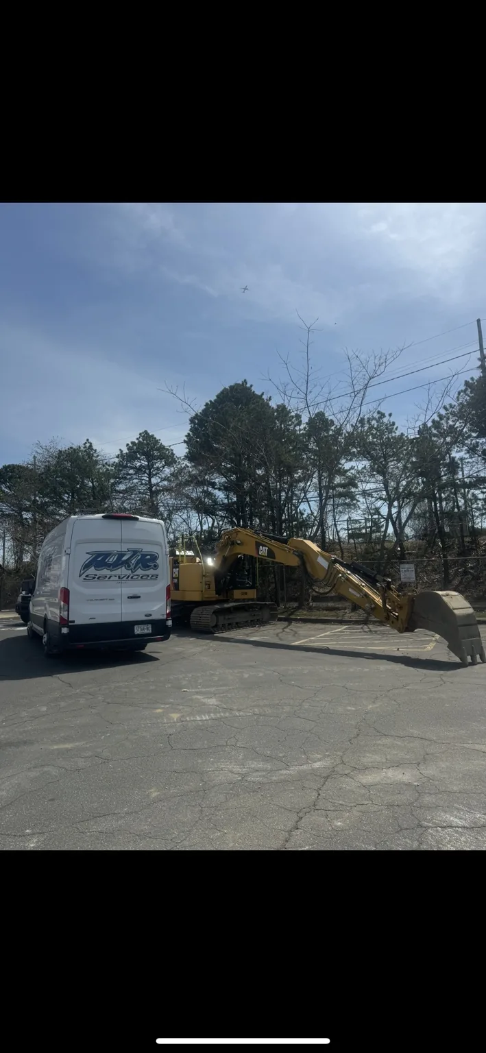 AVR Services van beside CAT heavy equipment
