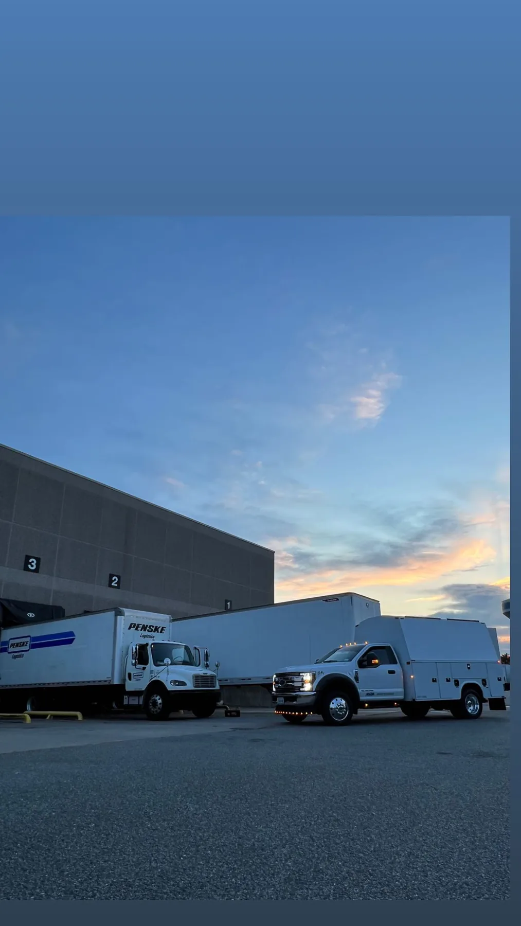 AVR Services mobile repair truck assisting a Penske fleet vehicle at sunset