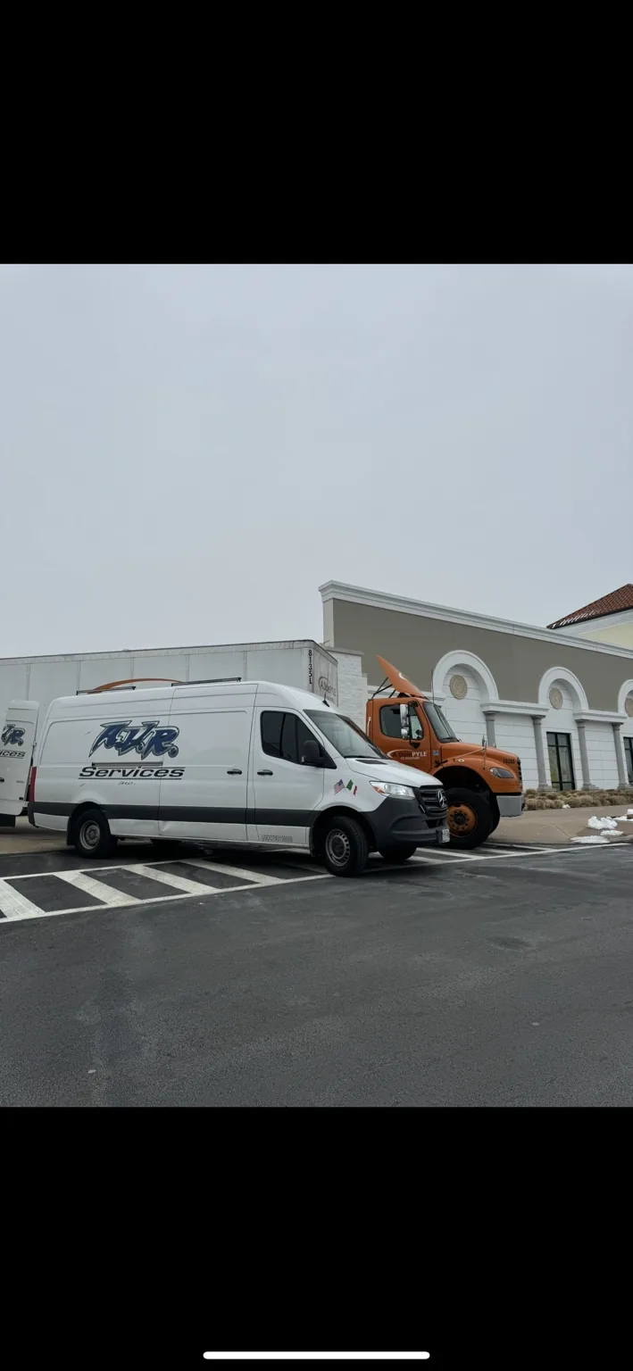 PFC refrigerated trucks lined up at a fleet yard in Yaphank